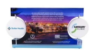 Custom Lucite design with two spinning logos celebrating a strategic partnersnip