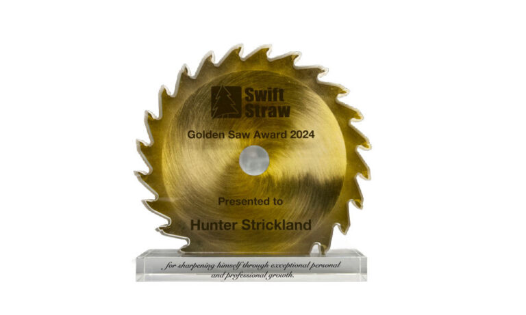 Custom crystal employee award with the shape and color of a  brass sawblade