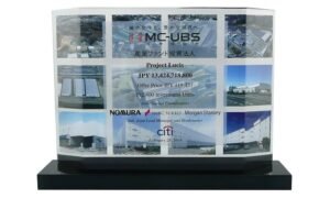 Commemorative recognizing multiple properties in real estate portfolio