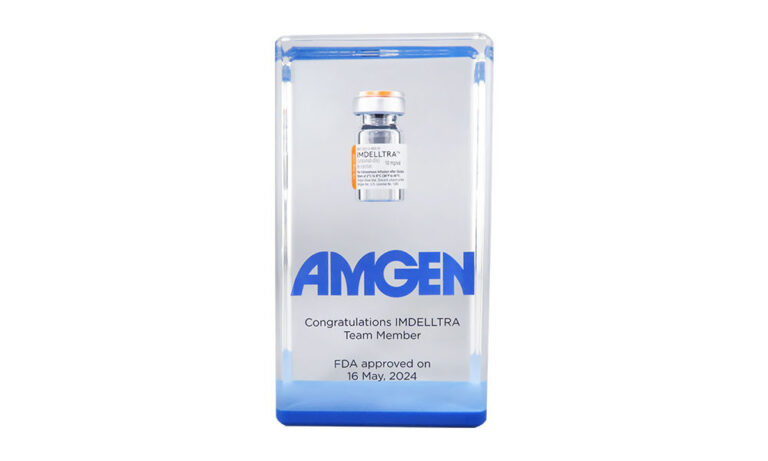 Drug vial embedded in Lucite celebrating FDA approval of a lung cancer treatment developed by Amgen.
