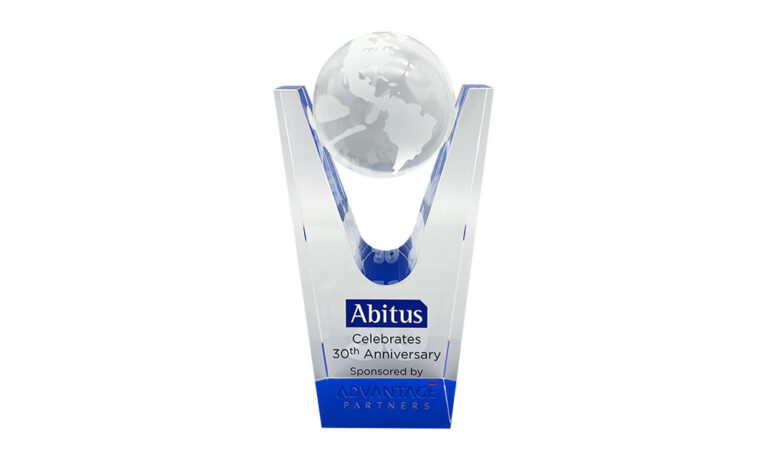 Crystal commemorative, featuring an etched globe on a pedestal base, celebrating the 30th anniversary of Japanese education company Abitus.